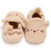 Pair of beige knitted baby walking shoes shaped like cats