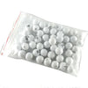 A clear plastic bag filled with white numbered balls for bingo and lottery games