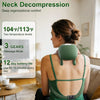 A woman is using a green neck massager on her upper back while sitting indoors.