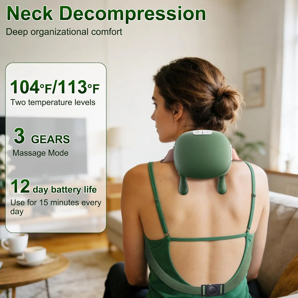A woman is using a green neck massager on her upper back while sitting indoors.