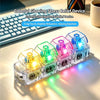 A clear plastic case holds four colorful glowing stress relief devices, featuring LED lights, next to a keyboard.