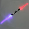 A toy lightsaber with a clear plastic blade emitting pink and blue laser light.