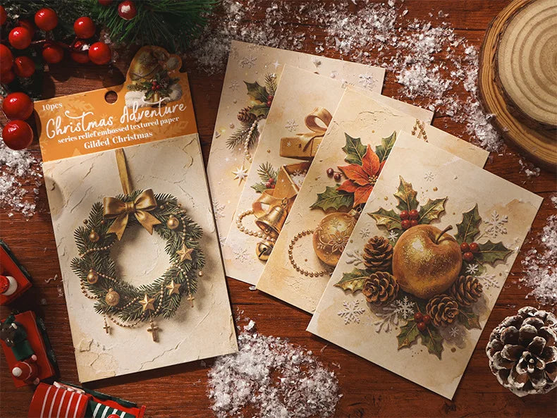 A pack of ten sheets of embossed Christmas adventure themed decorative paper featuring festive holiday designs and ornaments.