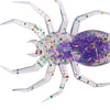 A realistic spider soft bait lure with translucent white legs and a purple body covered in iridescent glitter.