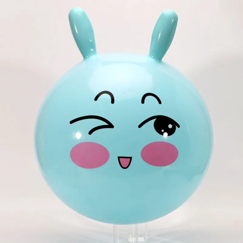Light blue inflatable hopper ball with pink accents and handle for kids' play