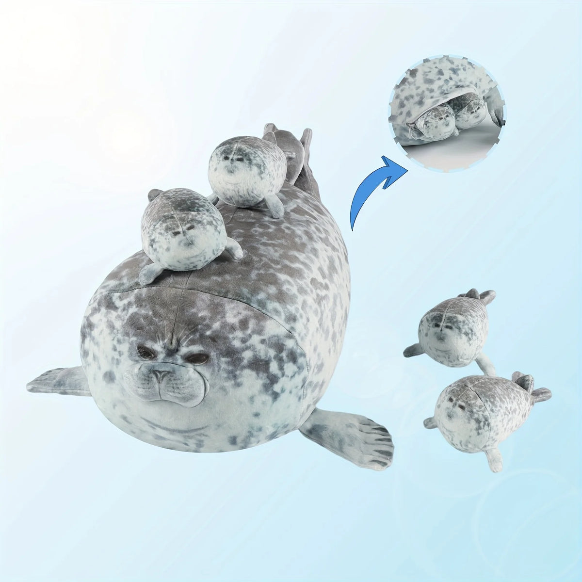 A plush seal family pillow featuring a large adult seal and four baby seals.