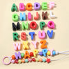 A collection of colorful acrylic alphabet beads arranged in alphabetical order.