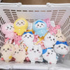 A collection of adorable Usagi Hachiware plush keychains in various pastel colors and designs inside a white basket.