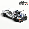 A detailed 1:64 scale diecast model of a white AE86 sports car with a black hood and racing livery.