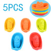 Five colorful floating bath boat toys in various colors including yellow, orange, green, and blue.