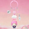 A pink acrylic necklace featuring a cloud charm and a blind box figure of a character.