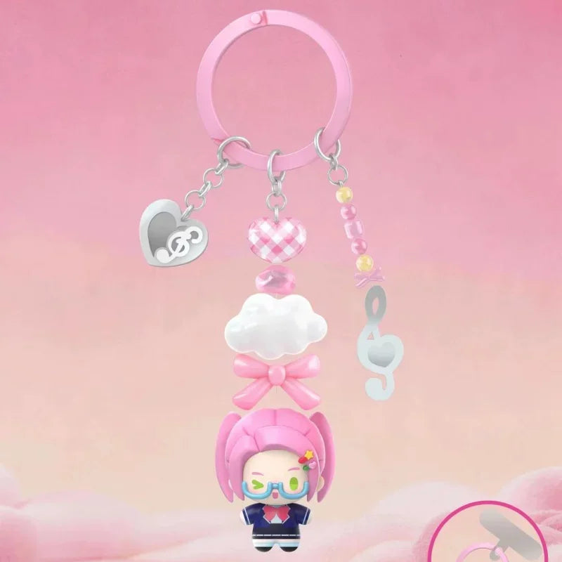 A pink acrylic necklace featuring a cloud charm and a blind box figure of a character.