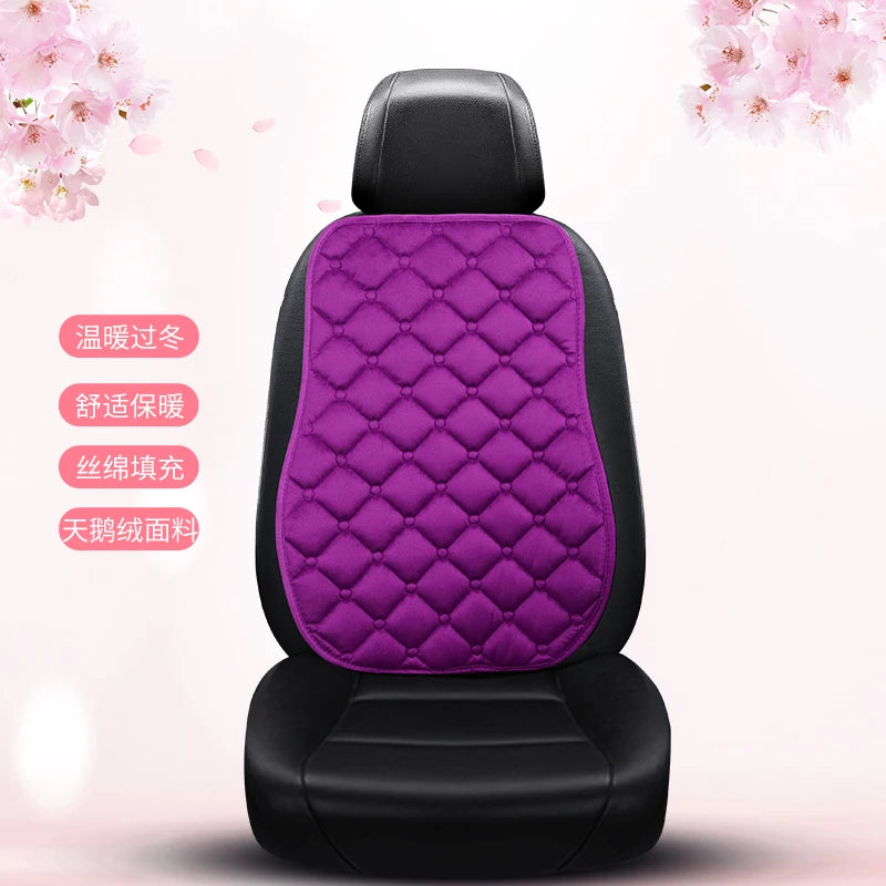 A black car seat cushion with a purple quilted cover, featuring text indicating warmth and anti-slip properties.