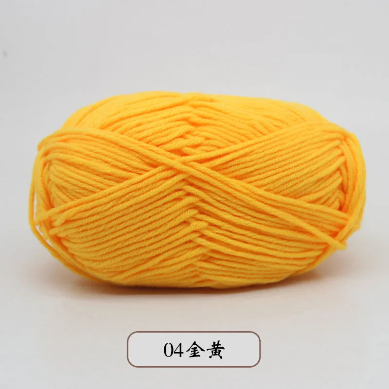 A ball of bright yellow pre-dyed milk cotton yarn for knitting and crochet.