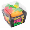 A clear plastic container holding a set of three fruit squishy fidget toys: strawberry, banana, and orange.