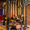 A detailed diorama featuring a wooden miniature train and rail track setup within a fantasy steam age city dollhouse scene.