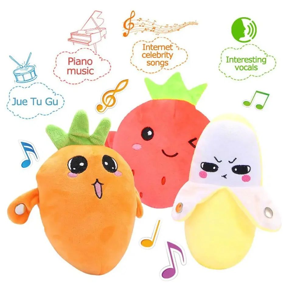 A collection of fruit-themed sensory plush toys including a carrot, strawberry, and a yellow fruit.