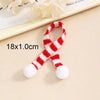 A set of mini knit Christmas hats and scarves featuring red and white stripes with white pom-poms.