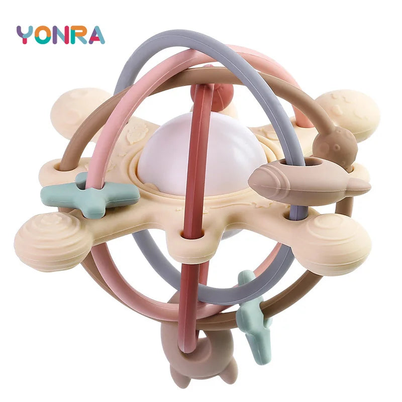 A silicone rattle and sensory ball for baby teething featuring various colors like pink, purple, and beige.