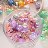 A clear bowl filled with colorful Y2K acrylic bow and flower beads for DIY jewelry making