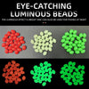 A collection of eye-catching luminous beads in red, white, and green colors.