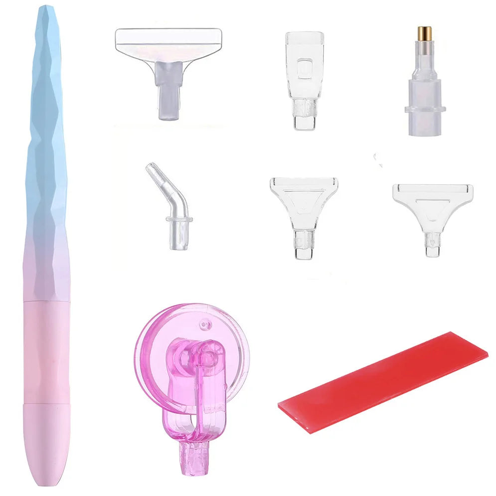 A collection of diamond painting tools including a pen, roller, and various shaping tools in pink, clear, and red.