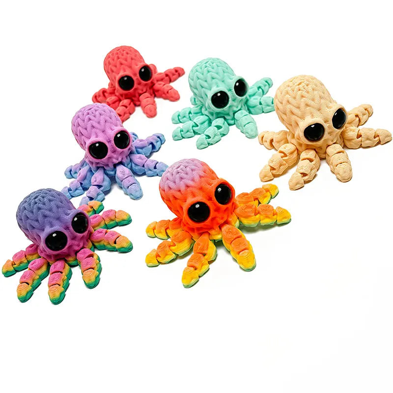 A collection of colorful 3D printed articulated octopus fridge magnets in various shades of pink, blue, green, and yellow.