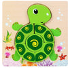 A green turtle puzzle made of wood surrounded by colorful sea plants and starfish.