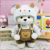 A white teddy bear plush doll wearing a brown clothing set with a fuzzy patch and white trim.