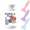 A white bottle of puzzle glue with a purple cap and a label showing instructions for easy pesting and drying.