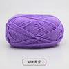 Purple pre-dyed milk cotton yarn in a skein for knitting and crochet