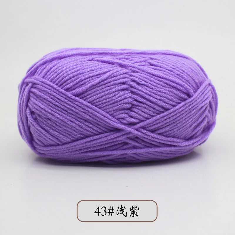 Purple pre-dyed milk cotton yarn in a skein for knitting and crochet