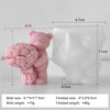 A pink silicone mold shaped like a bear holding roses, used for DIY crafts.