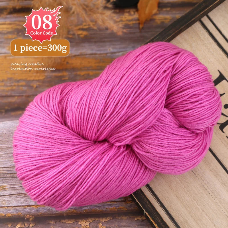 A ball of bright pink premium alpaca blend yarn used for knitting or weaving.