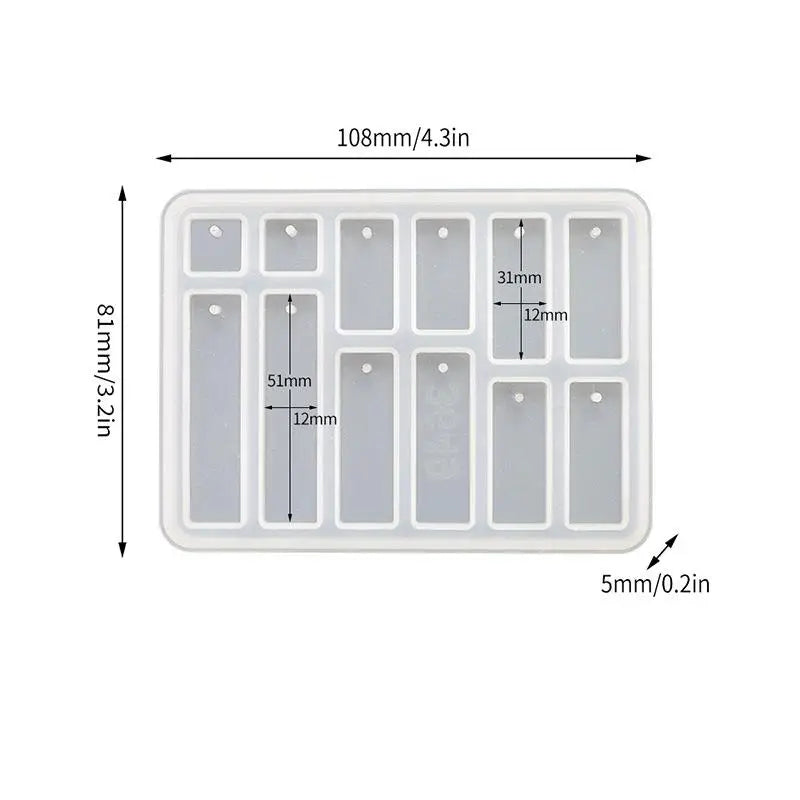 A white geometric silicone mold set with multiple cavities for making epoxy resin earrings and pendants.