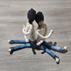 A pair of poseable plush dolls resembling L Lawliet from Death Note, dressed in light beige tops and blue jeans.