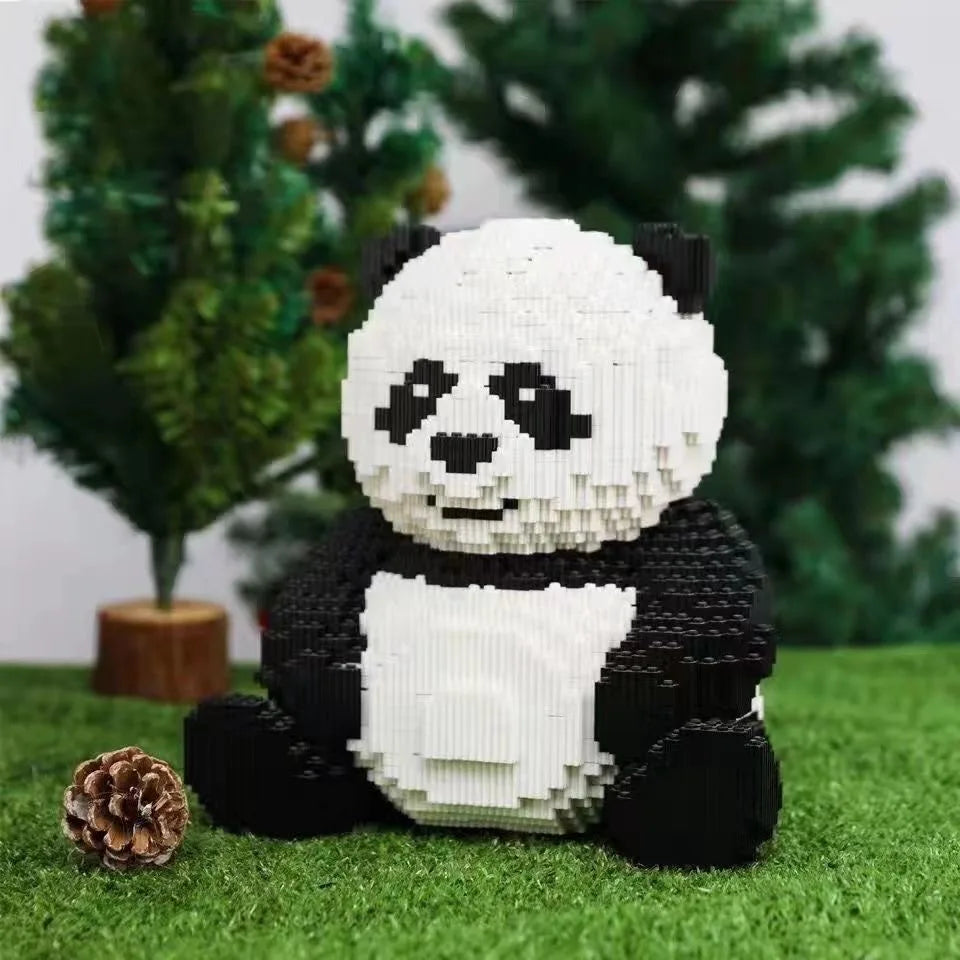 A lifelike building block panda 3D model set featuring black and white blocks sitting on green grass.