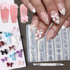 A hand displays various pink and white silicone nail molds featuring bowknot designs and a carving pen.