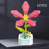 A set of 157 pink and yellow rose flower building blocks arranged in a bouquet on a white base.