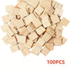 A pile of light wood alphabet letter tiles for DIY crafts and games