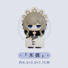 A chibi figurine of a character with light gray hair and blue eyes wearing a white outfit with black accents.