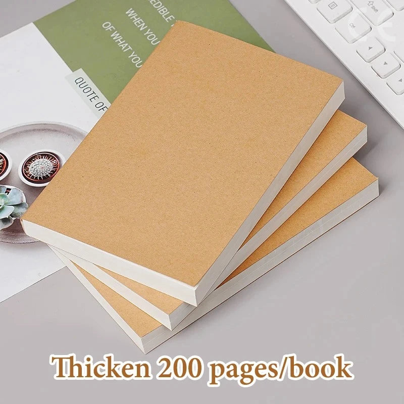 A stack of thick brown kraft paper notebooks or books with white covers, shown on a gray surface.