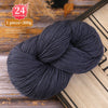 A ball of dark gray premium alpaca blend yarn used for knitting or weaving.