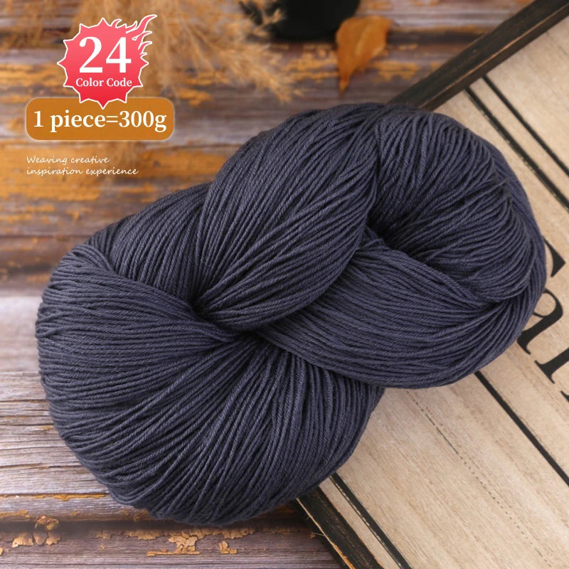 A ball of dark gray premium alpaca blend yarn used for knitting or weaving.