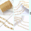 Various DIY gold-plated brass chains and round spacer beads for jewelry making displayed on a white background.