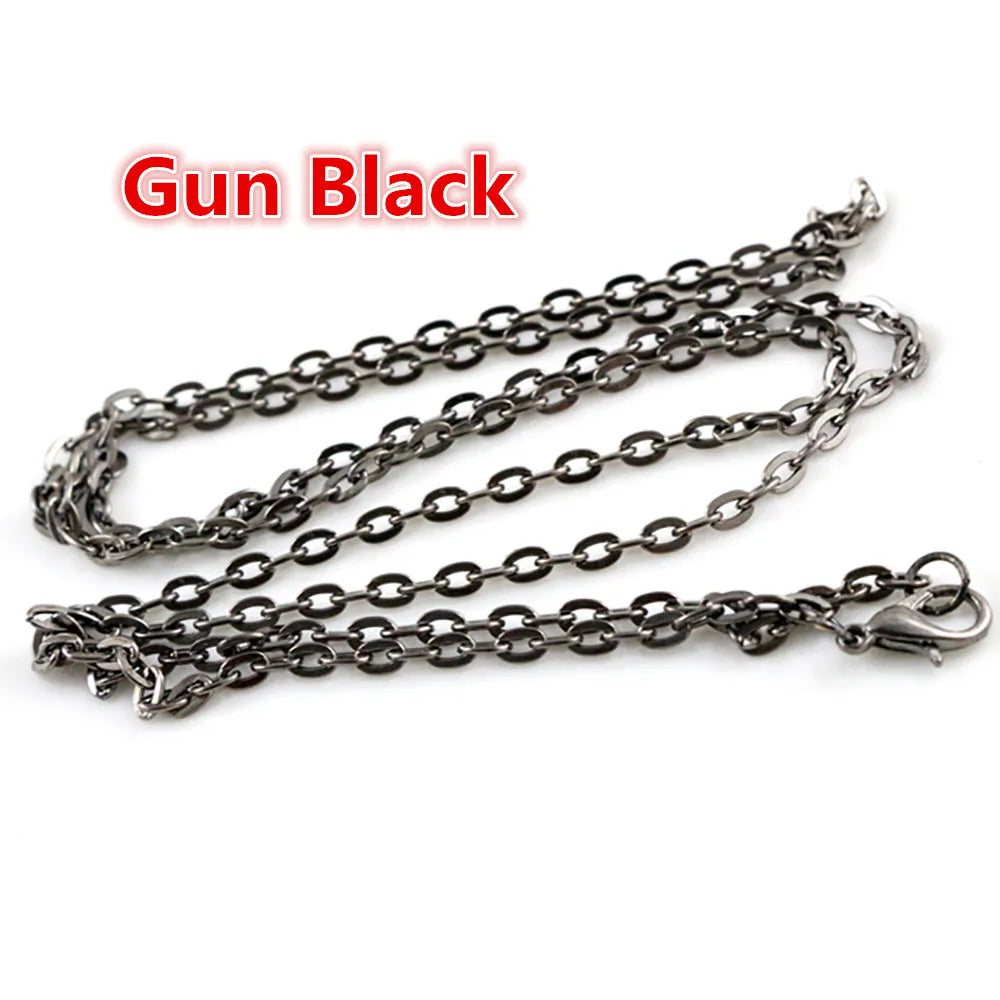 A set of black gun-style chain connectors used for jewelry making.