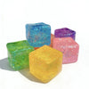 A collection of square stress relief fidget toys in various colors including blue, green, yellow, and pink.