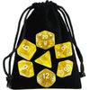 A black drawstring bag filled with transparent polyhedral dice, including a d10, d8, d6, and d20.