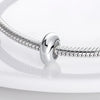 A silver charm bead is shown attached to a flexible silver chain, ready for DIY bracelet making.