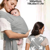 A woman is wearing a grey knitted fabric baby carrier with a baby, demonstrating its adjustable length.